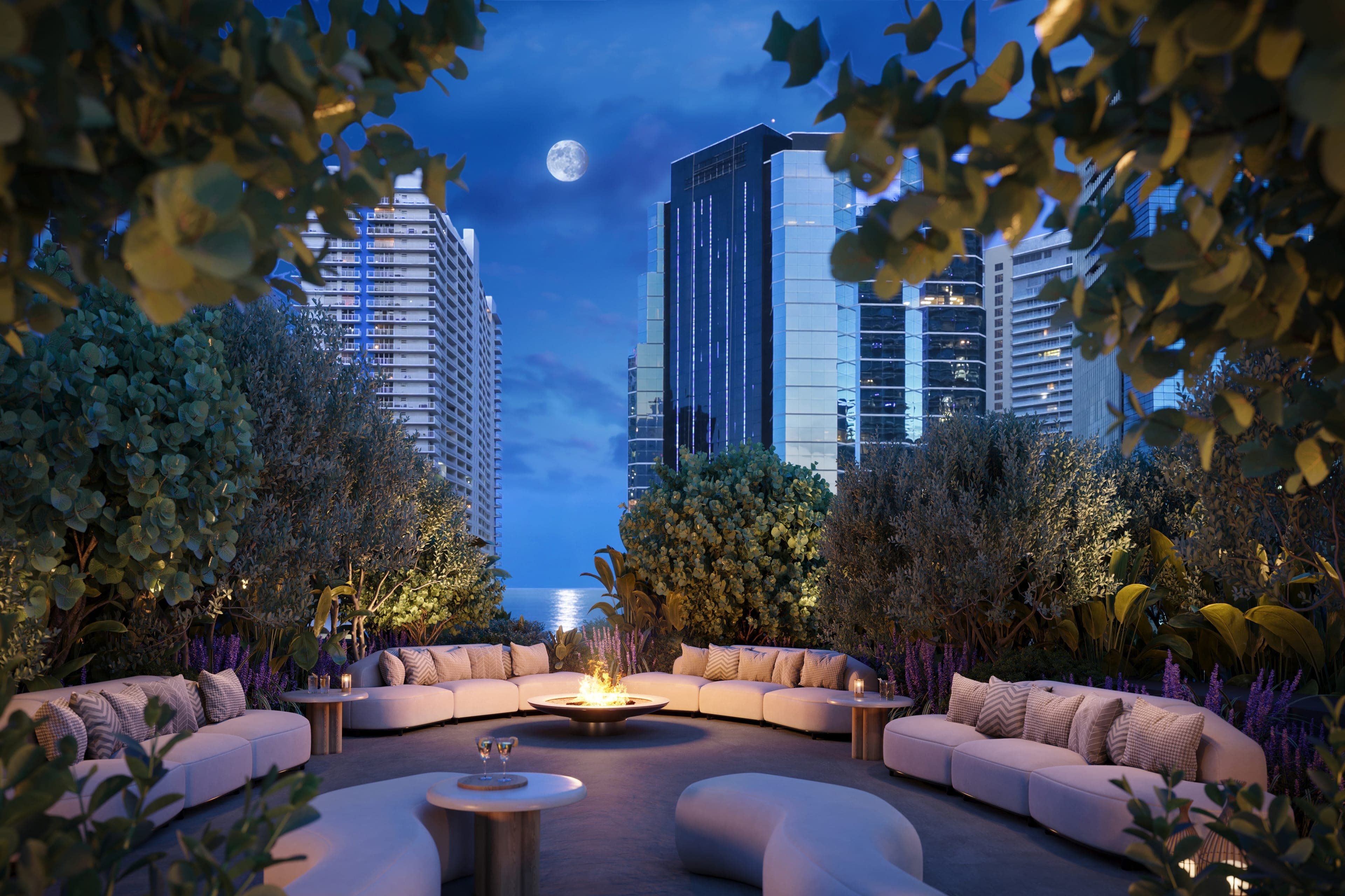 A 9th floor pool lounge nook at night, moon over the bay